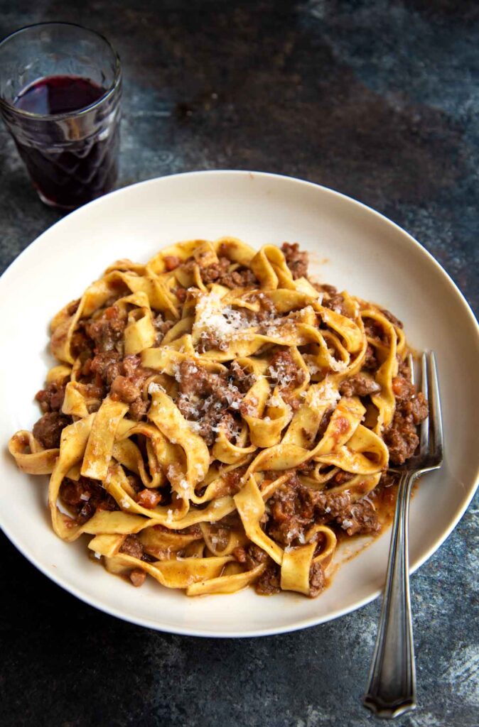 Tagliatelle al ragù in Bologna—classic comfort in a bowl, spotlighted by Stanley Tucci and rooted in rich food tradition.