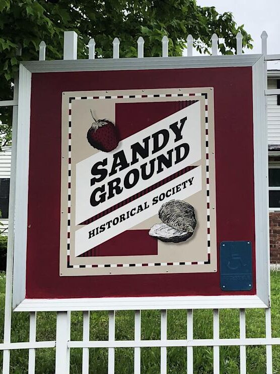 Historic Sandy Ground cemetery and marker — symbol of early Black oyster farming and community resilience.