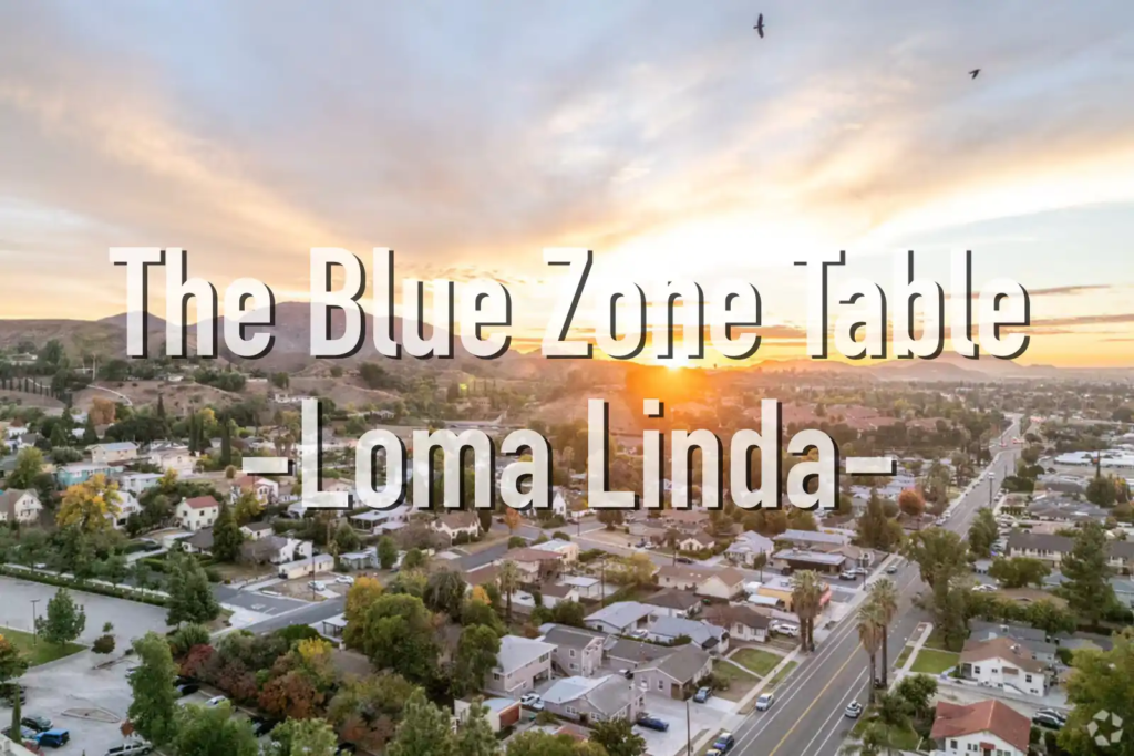 Aerial view of Loma Linda, California at sunset, showing a quiet residential neighborhood and surrounding hills—representing America’s only Blue Zone.