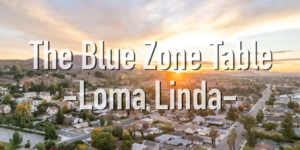 Aerial view of Loma Linda, California at sunset, showing a quiet residential neighborhood and surrounding hills—representing America’s only Blue Zone.