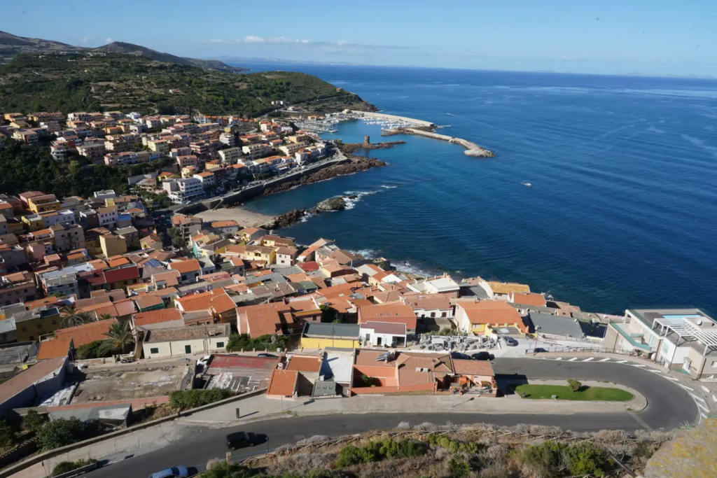 Aerial view of colorful coastal town in Sardinia overlooking the Mediterranean Sea