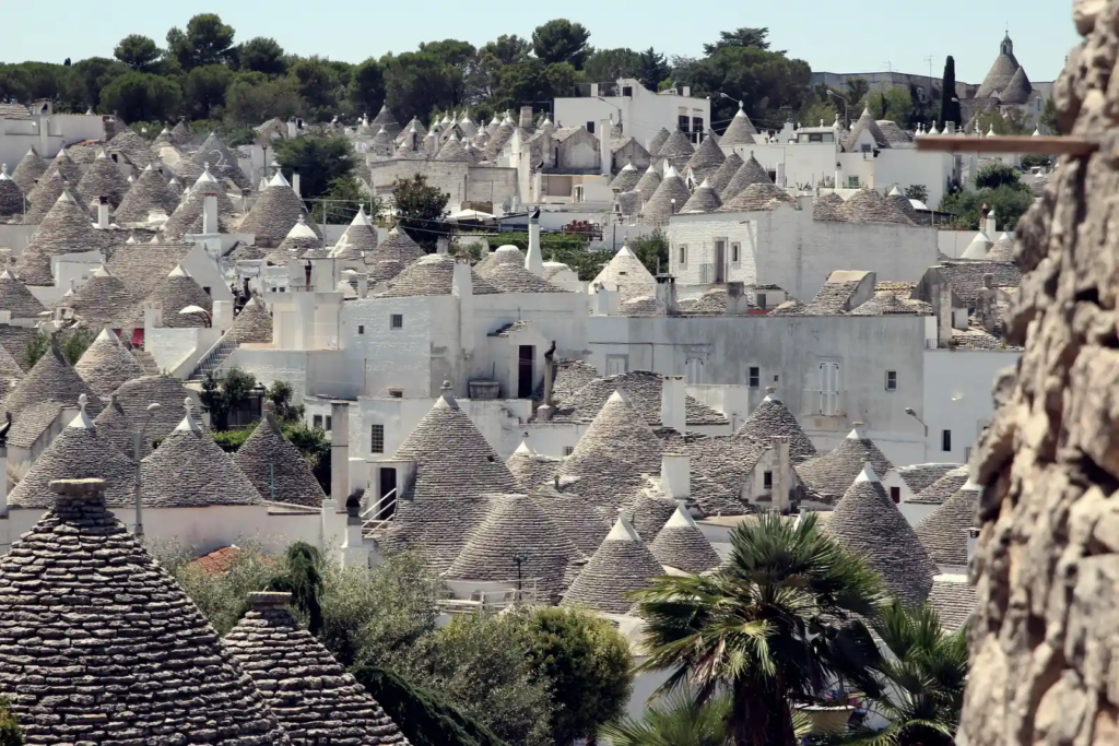 Traditional Trulli houses with conical stone roofs in Alberobello, Puglia, Italy