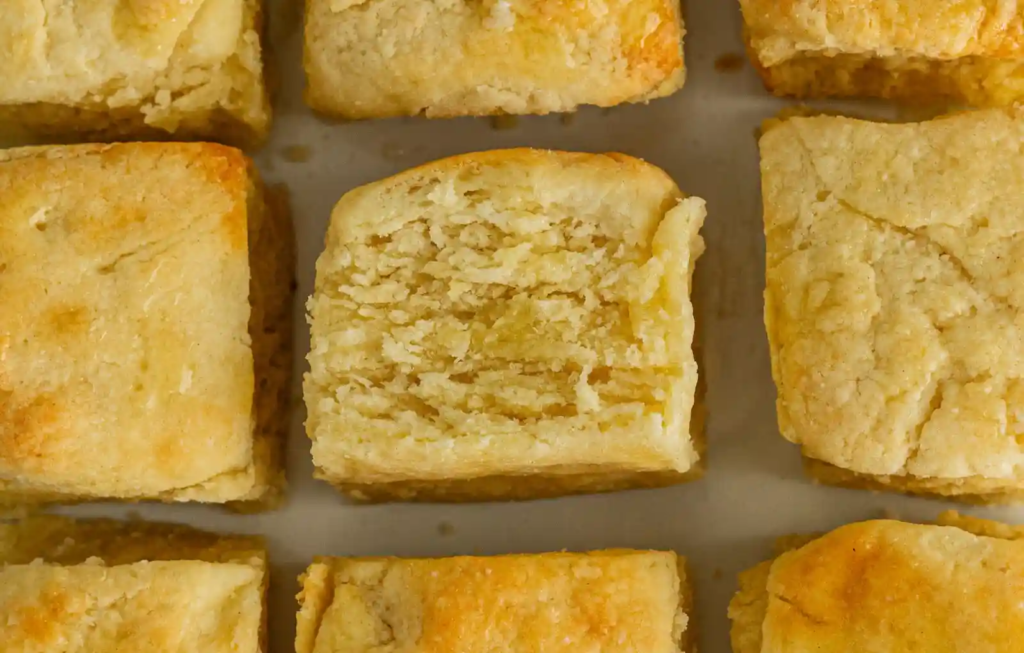 Callie’s Hot Little Biscuit—close-up of square buttermilk biscuits showing tall, flaky layers.