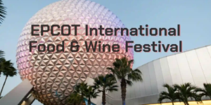 Spaceship Earth at EPCOT at dusk, palm trees in the foreground with soft pink-purple lighting on the geodesic sphere.